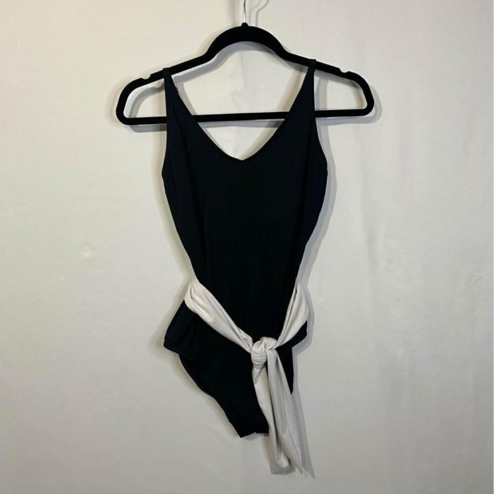 Woman’s one piece swimsuit with white sash. Size Large. Excellent condition.
